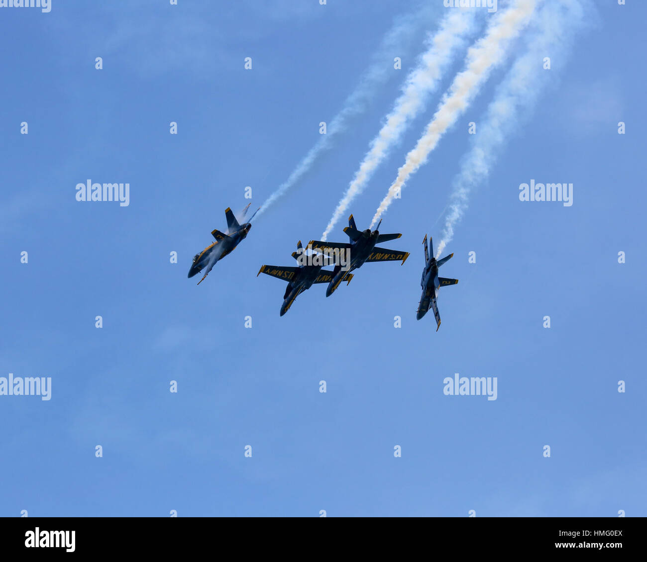U.S. Navy Blue Angels aircraft breaking from diamond formation flight. Stock Photo