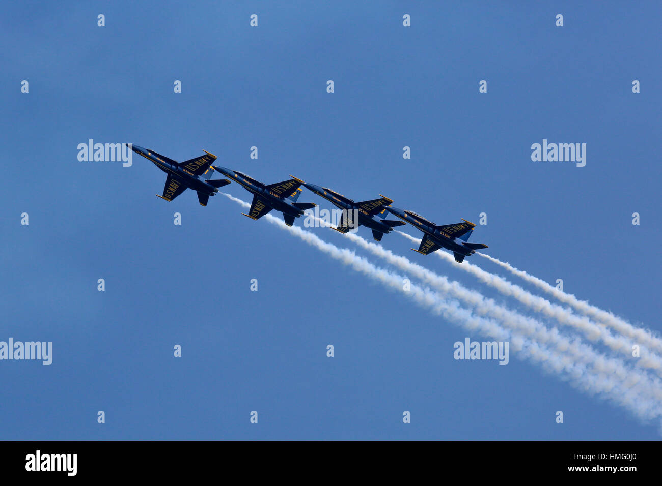 U.S. Navy Blue Angels F/A-18 aircraft in a left-echelon zoom Stock Photo