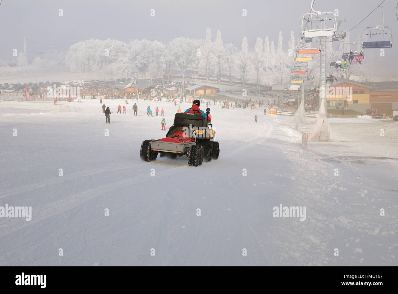 Ski patrol evacuate an injured skier on slope in winter Stock Photo