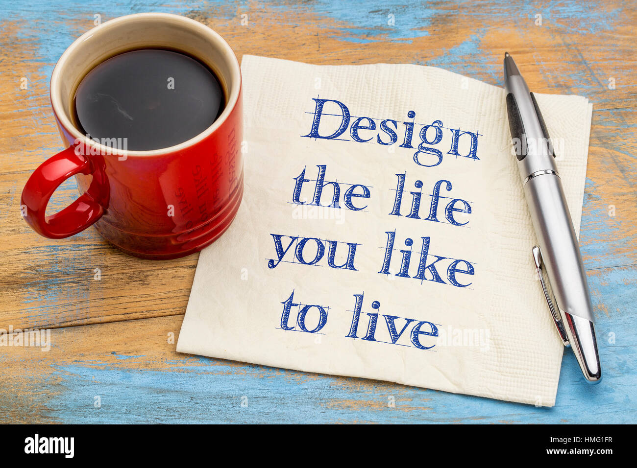 Design the life you like to live - handwriting on a napkin with a cup of coffee Stock Photo