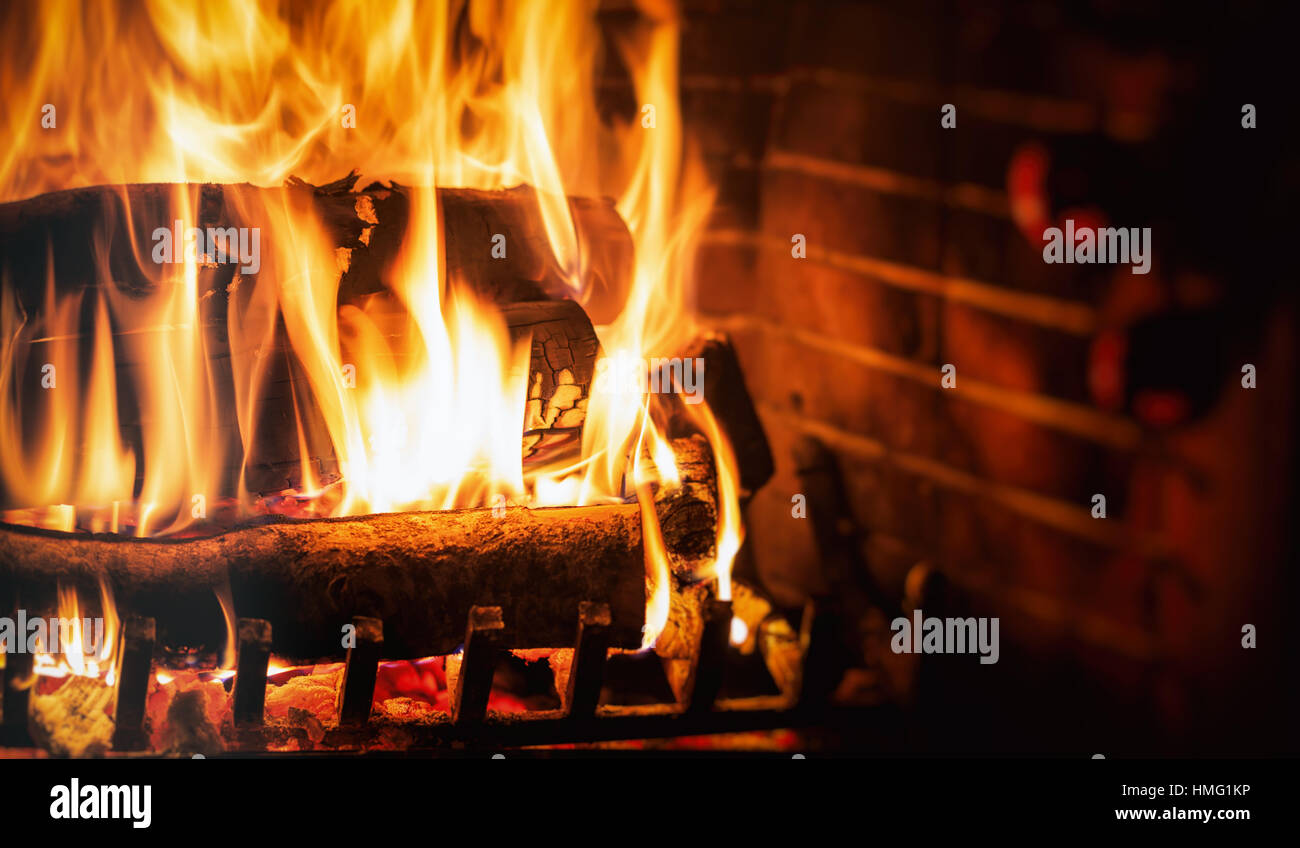 Burning logs in a fireplace Stock Photo Alamy