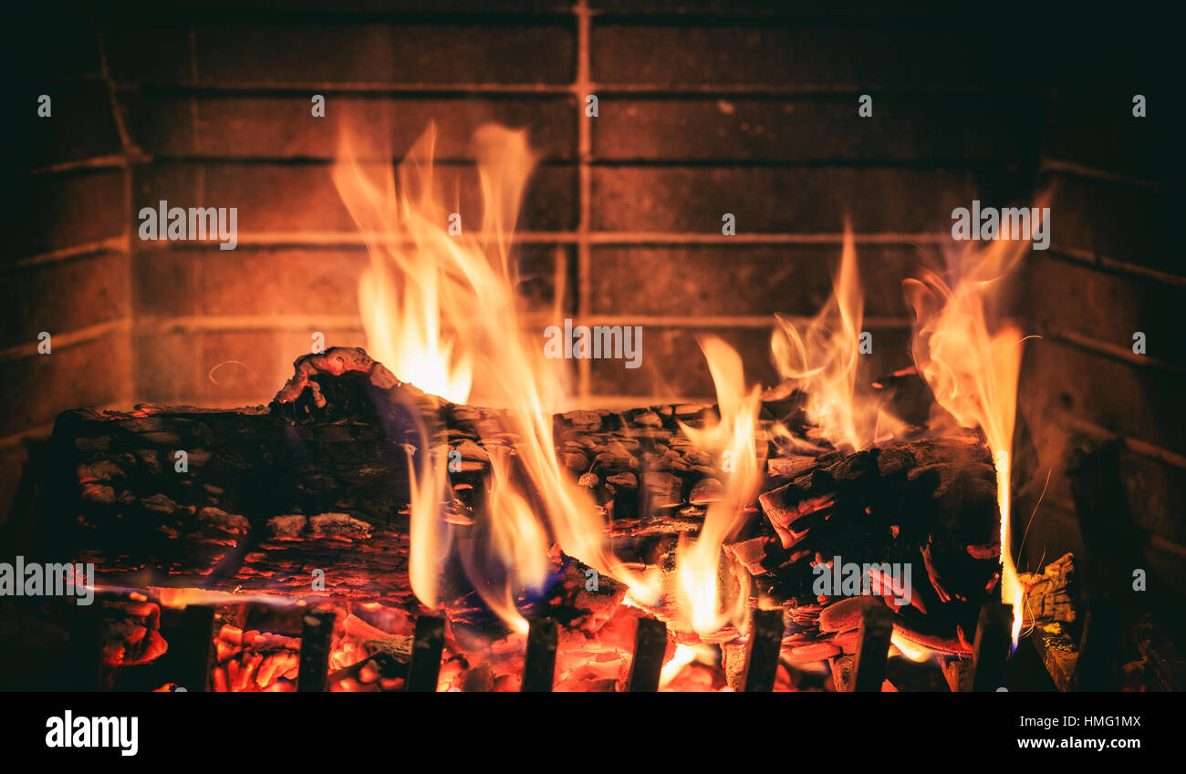 Burning logs in a fireplace Stock Photo Alamy