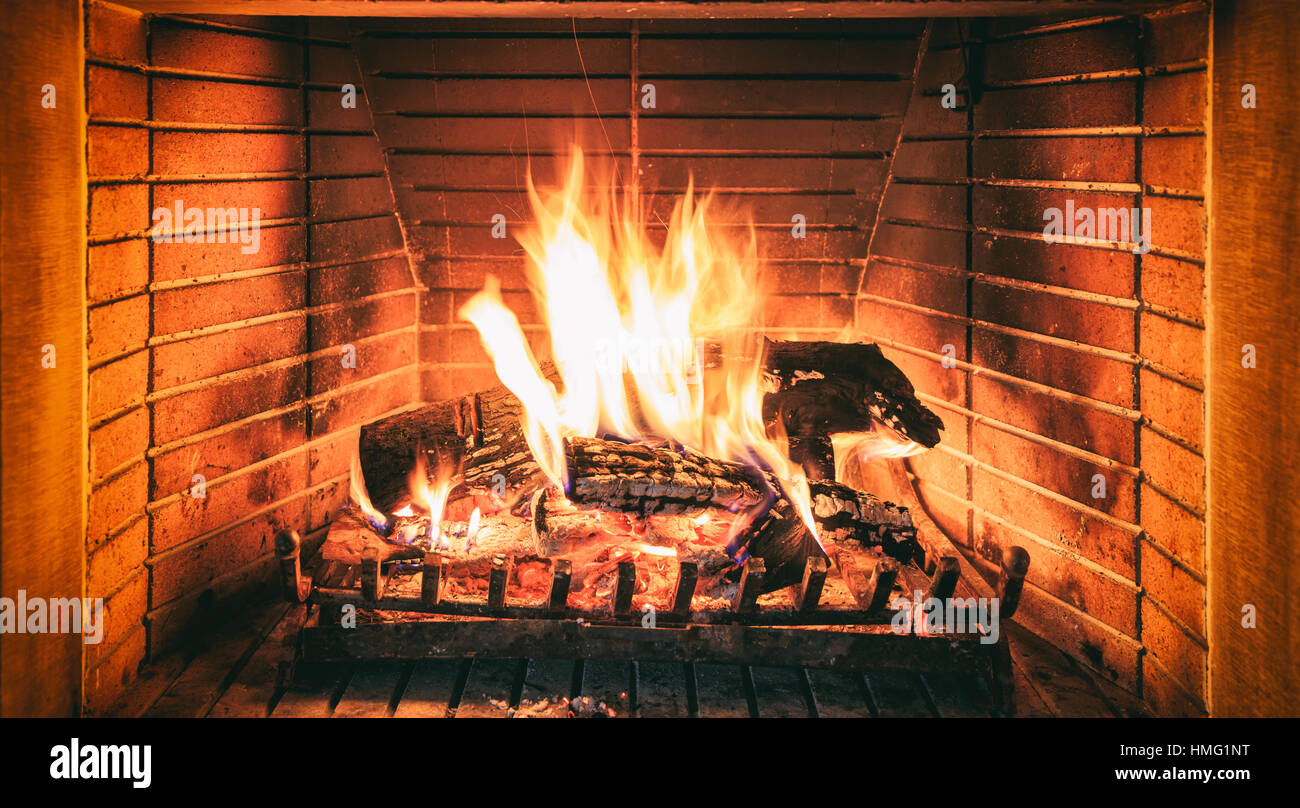 Burning logs in a fireplace Stock Photo Alamy