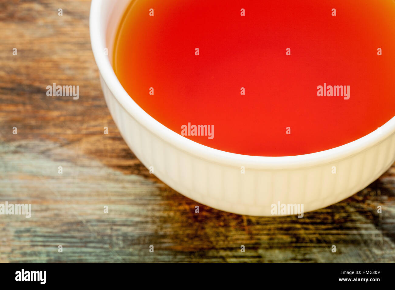 rooibos red tea made from the South African red bush, naturally caffeine free, white cup against