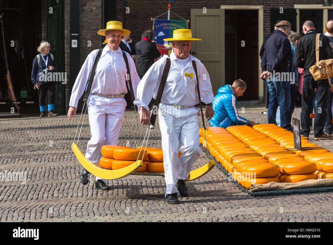 Guild cheeseporters carrying cheeses at the famous cheese market in