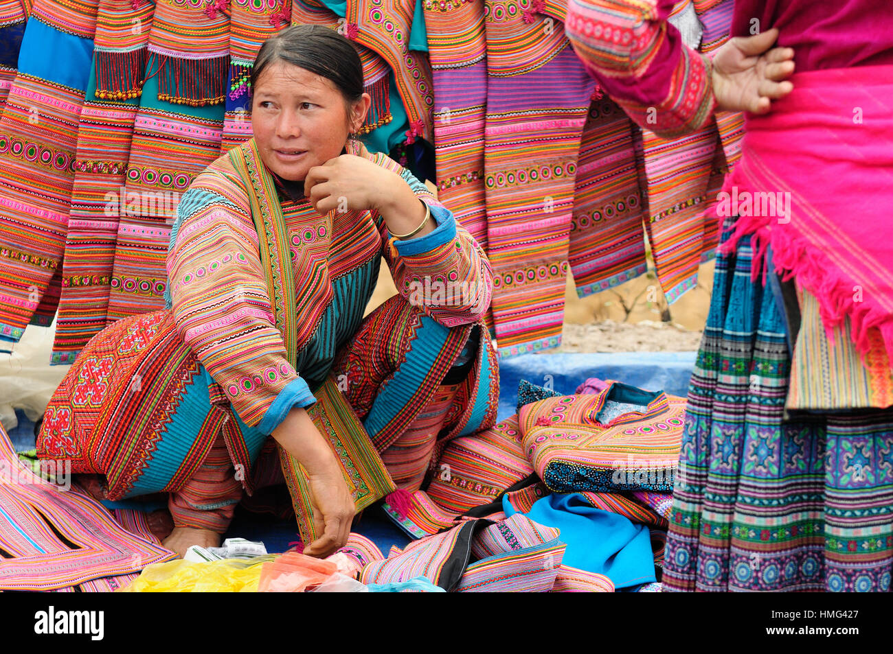 Sapa, Vietnam - October 22:  Woman in the traditional dress of Flower Homong people settling on the  mountain regions of the Sapa town selling traditi Stock Photo