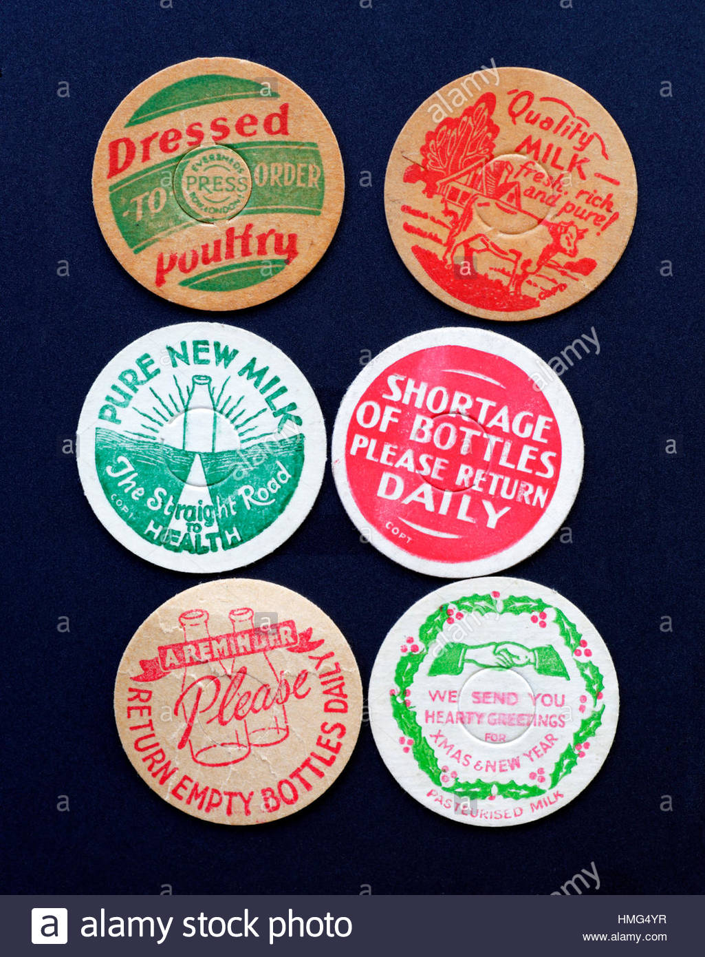 Old Milk bottle card caps from the 1940s Stock Photo