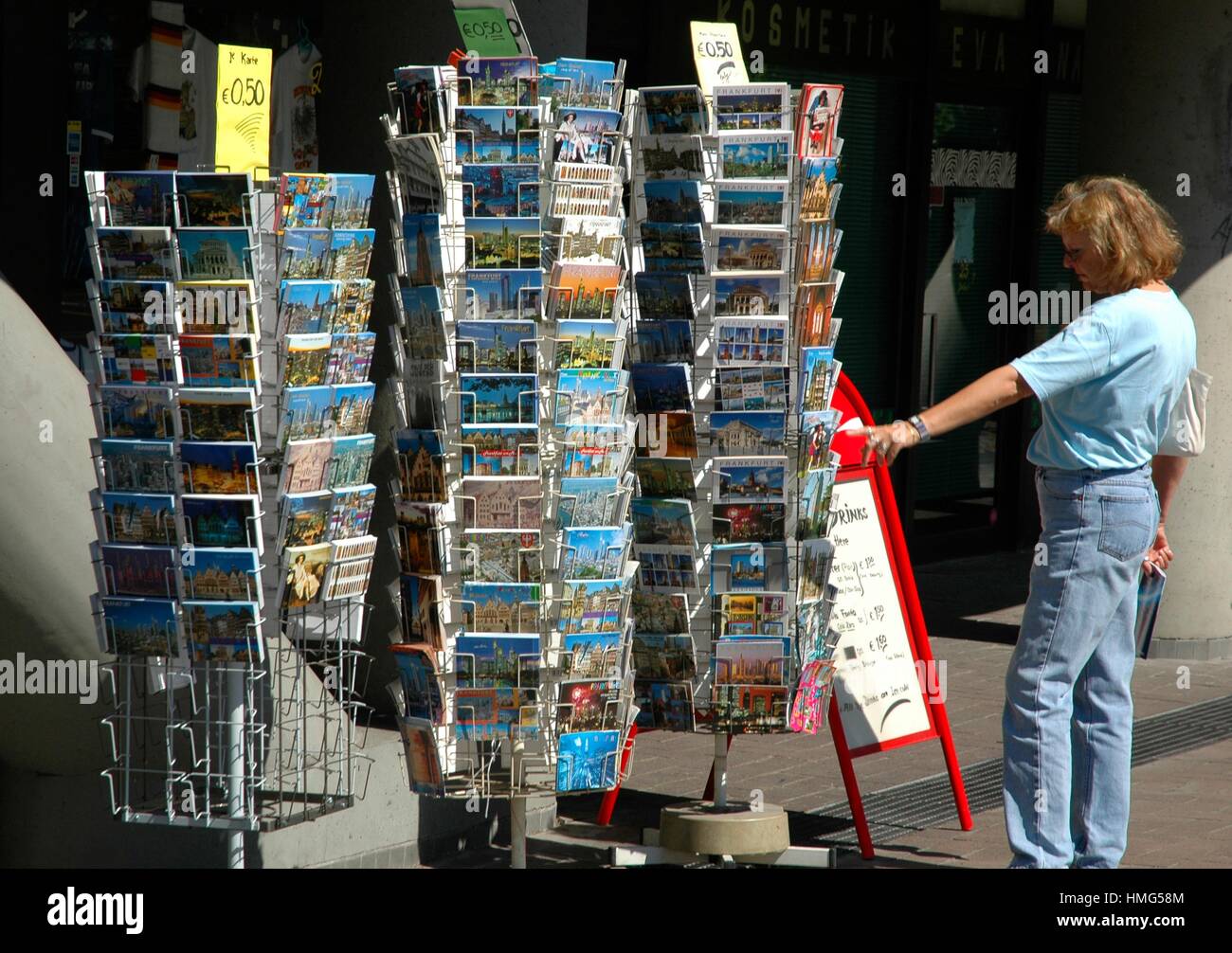 Frankfurt, Germany a tourist buying postcards Stock Photo Alamy