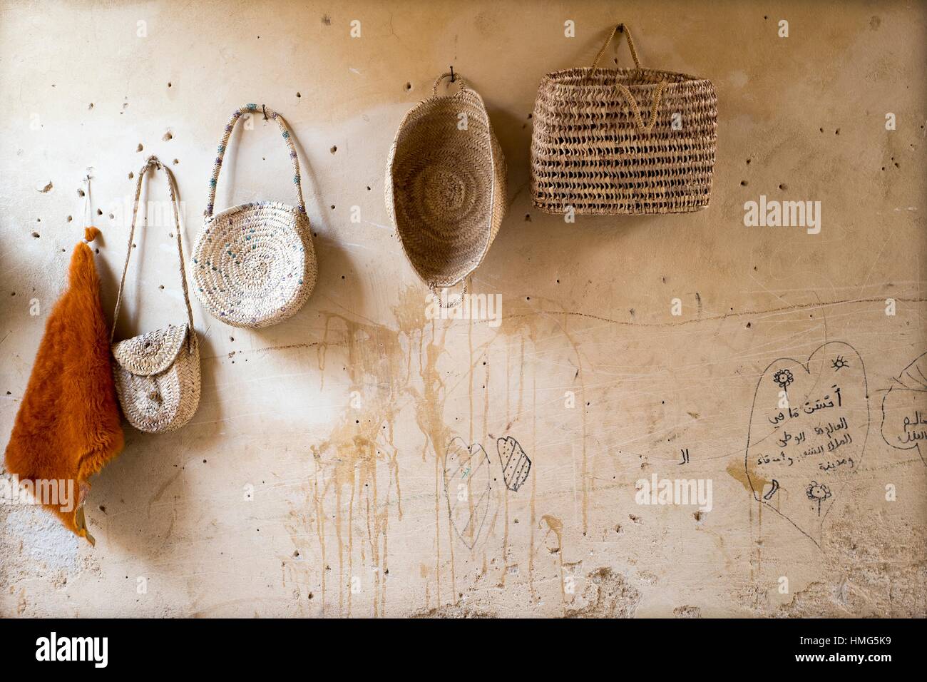 Wall of a market with hanging bags and baskets made of esparto