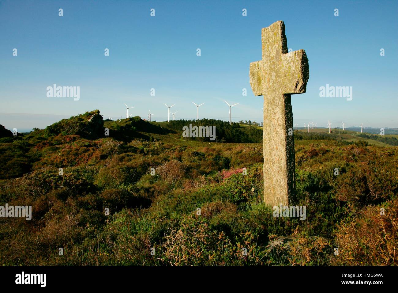 Stone cross over a neolithic tomb ''Cruz da Faladoira'', Sierra de A Faladoira, Galicia, Spain. Stock Photo