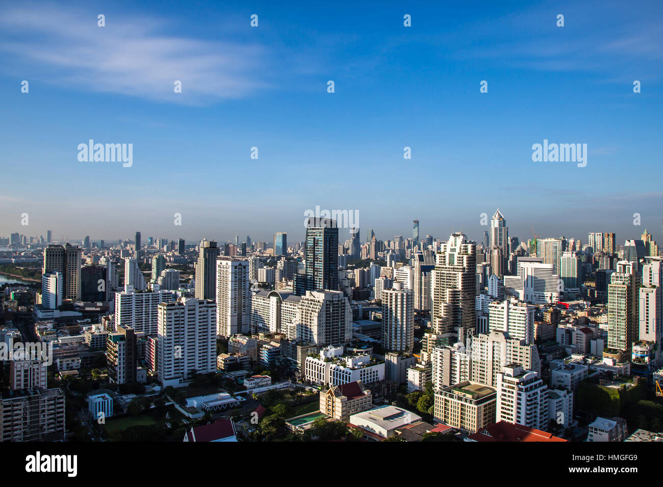 Cityscape under clouds and blue sky. Stock Photo