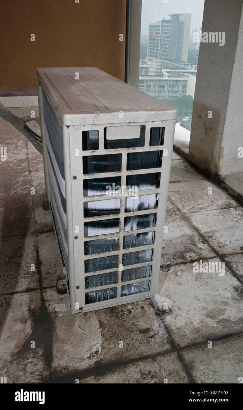 Ice on external heat exchanger unit of air conditioning in cold humid