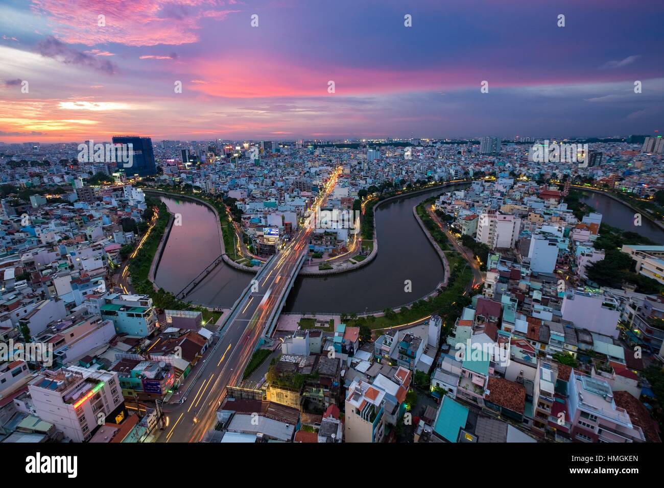 Aerial sunshine view of rooftop skyscraper on Nhieu Loc canal in Ho Chi ...