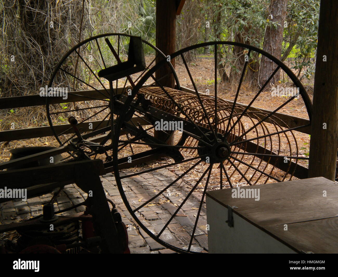 Seeing a antique horse drawn hay rake can make you nostalgic about  farm life long ago. Stock Photo