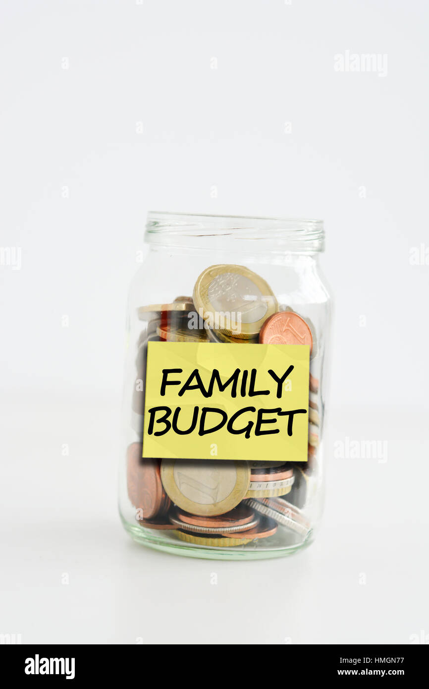 Isolated glass jar with family savings label filled with coins Stock ...