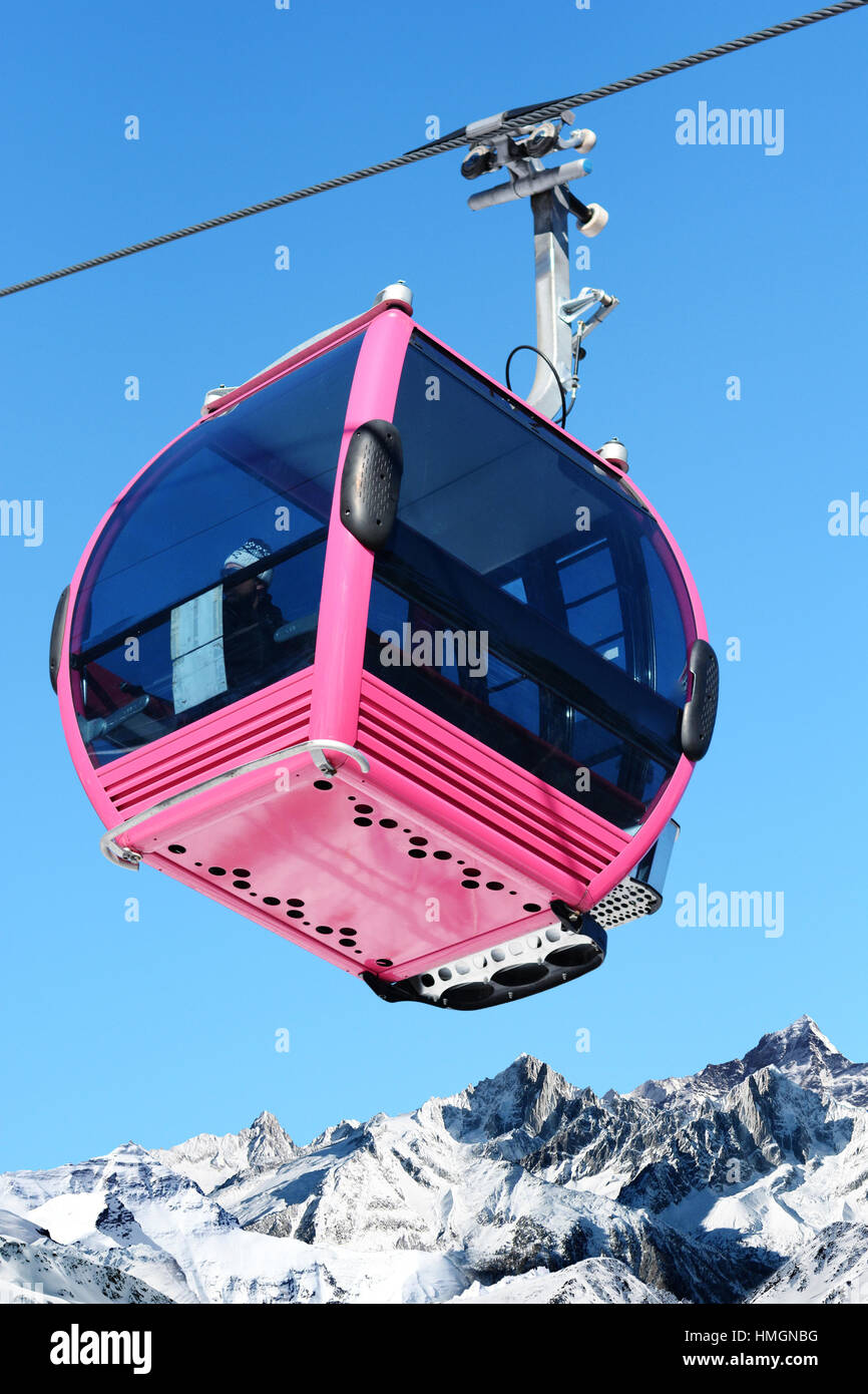 Pink cable car cabin on blue sky as background Stock Photo - Alamy