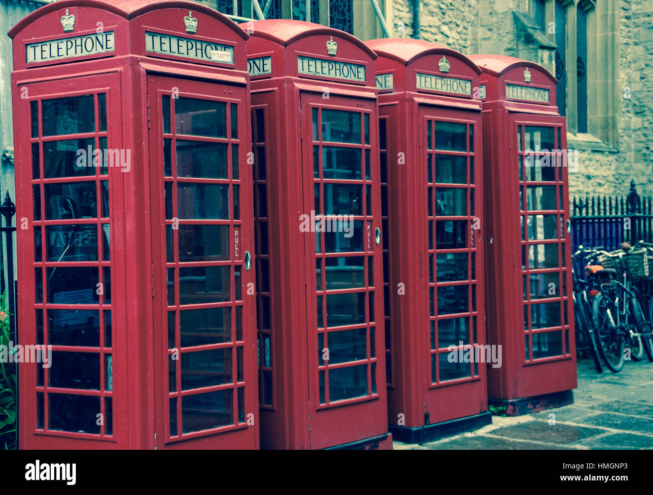 British red telephone boxes lined up in the street Stock Photo