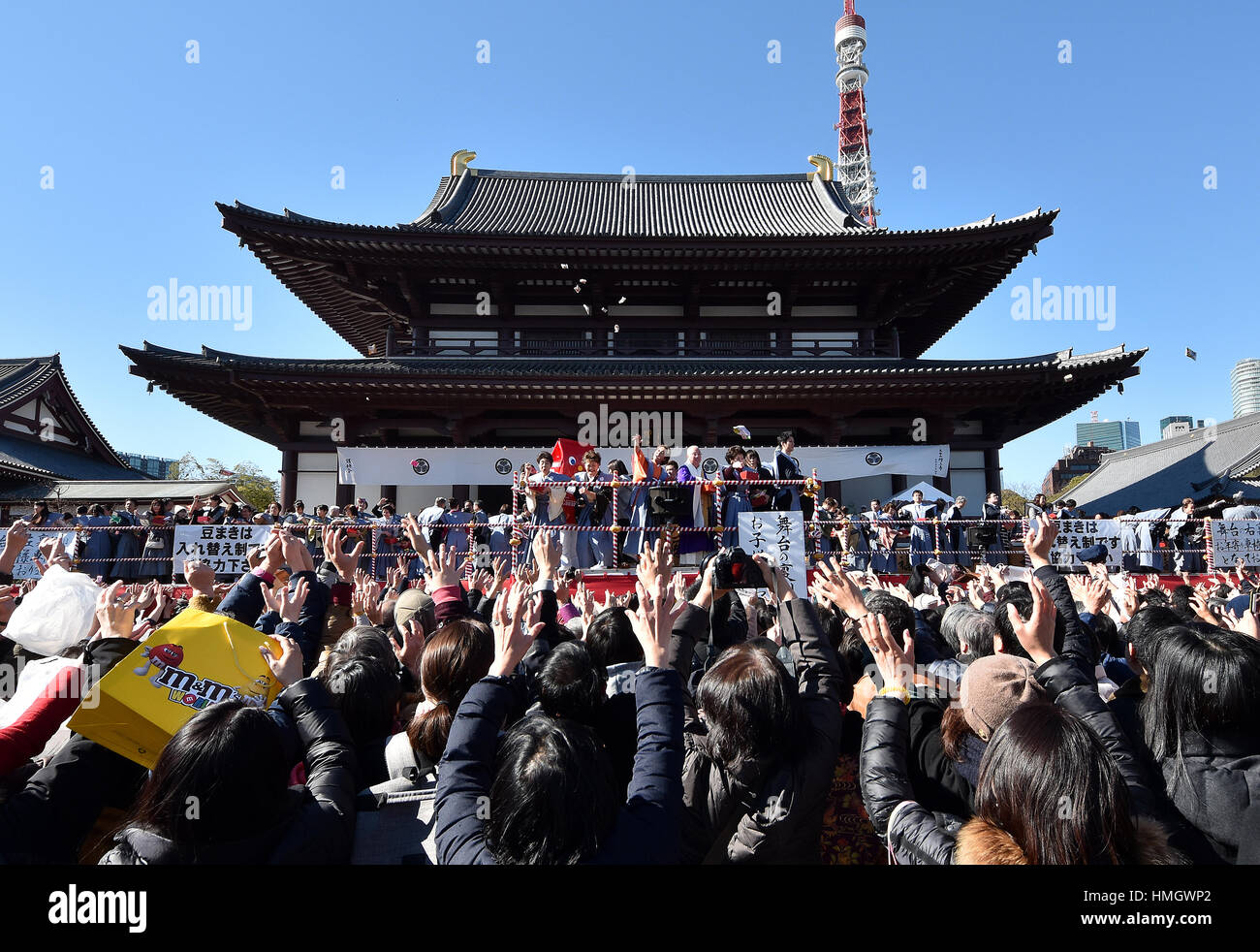 Tokyo, Japan. 3rd Feb, 2017. Sumo wrestlers and celebrities throw out lucky charms to a huge crowd in a traditional ritual celebrating the arrival of spring at Tokyos Zojoji Buddhist temple on Friday, February 3, 2017. Credit: Natsuki Sakai/AFLO/Alamy Live News Stock Photo