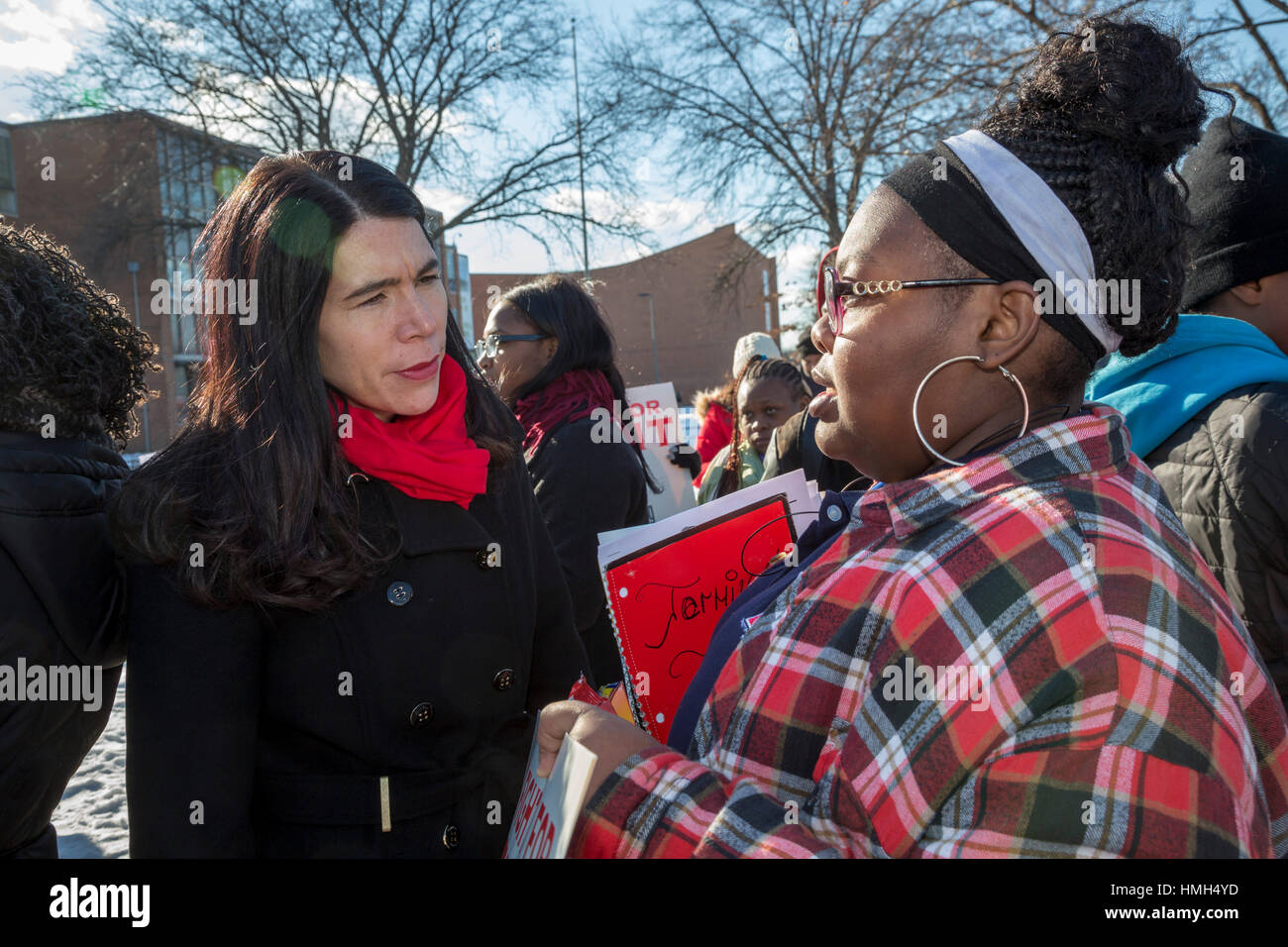 Detroit, USA. 3rd February, 2017. Students from Osborn High School protest against the planned closing of their school, one of 24 the state of Michigan wants to shut in Detroit because of poor academic performance. Detroit teachers have long complained about large class sizes, outdated textbooks, and lack of resources. Detroit Public Schools Interim Superintendent Alycia Meriweather talks to an Osborn student during the rally. Credit: Jim West/Alamy Live News Stock Photo