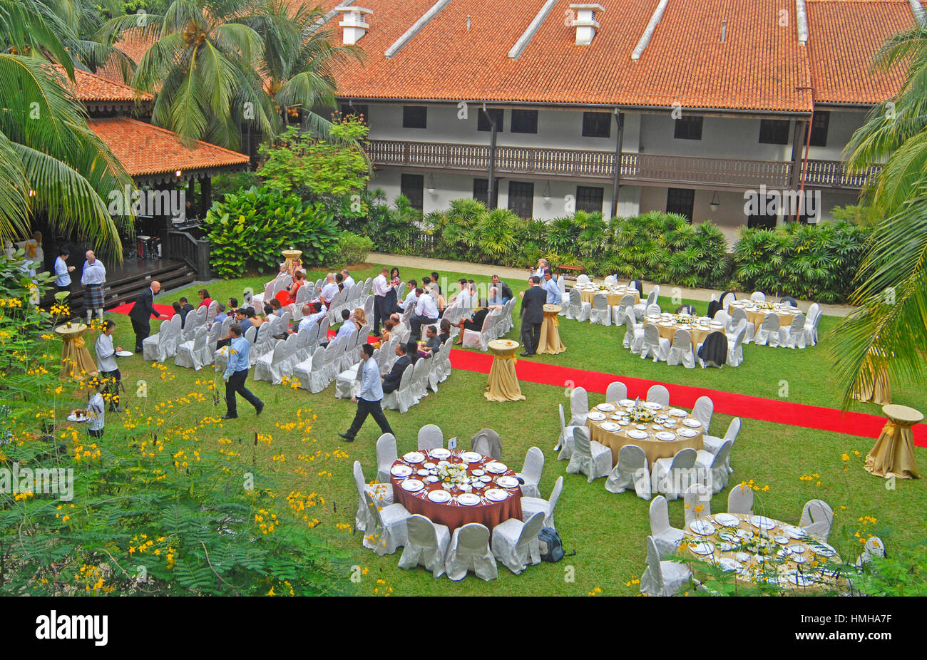 Wedding ceremony  in garden of Raffles hotel, Singapore Stock Photo