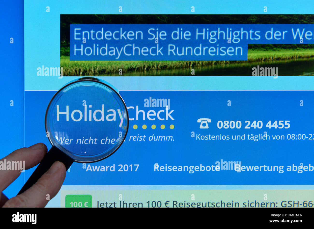 Holidaycheck.de, Internet, monitor, hand, magnifying glass, Monitor, Hand, Lupe Stock Photo