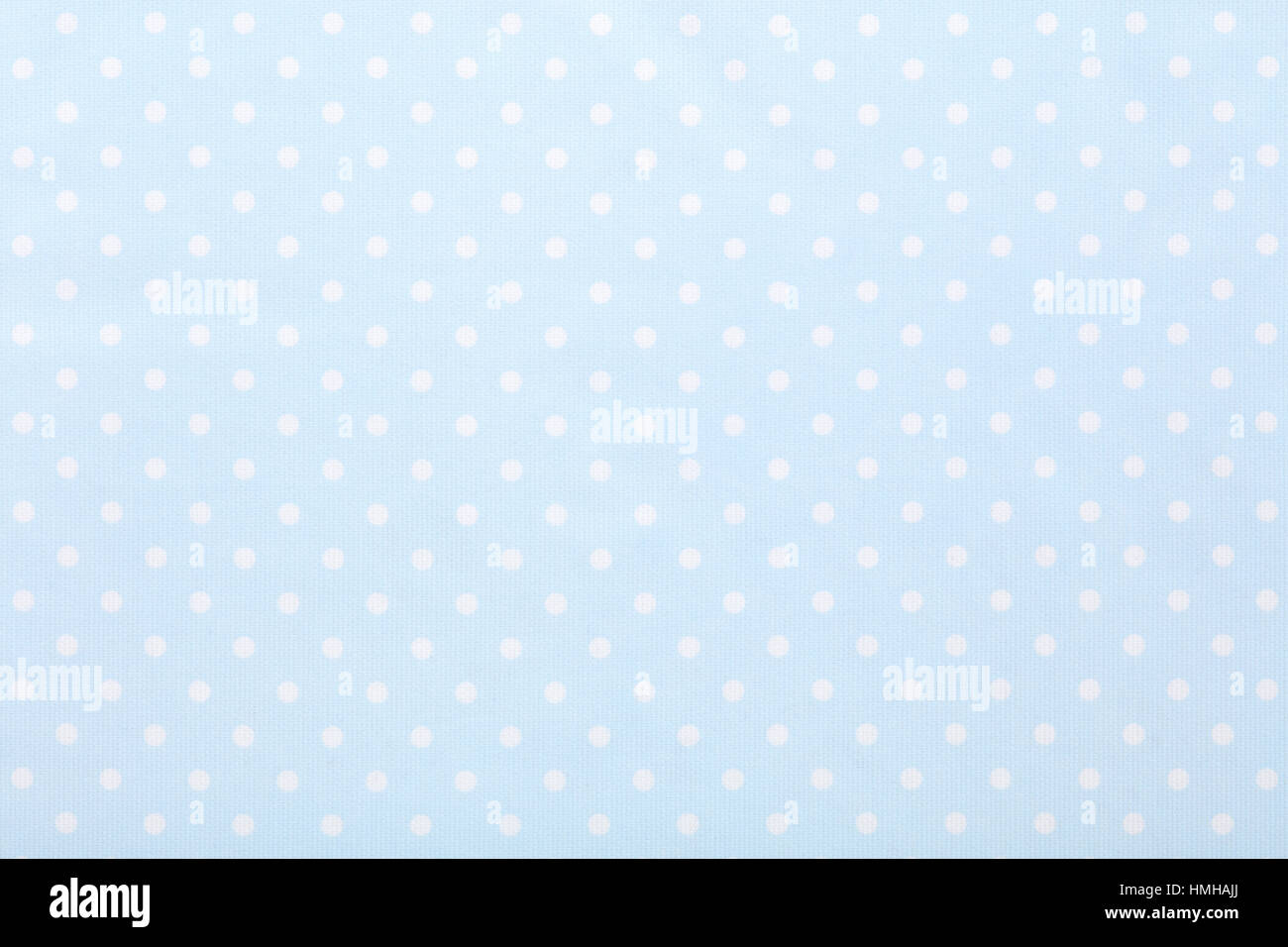 Baby blue polka dot fabric texture background Stock Photo