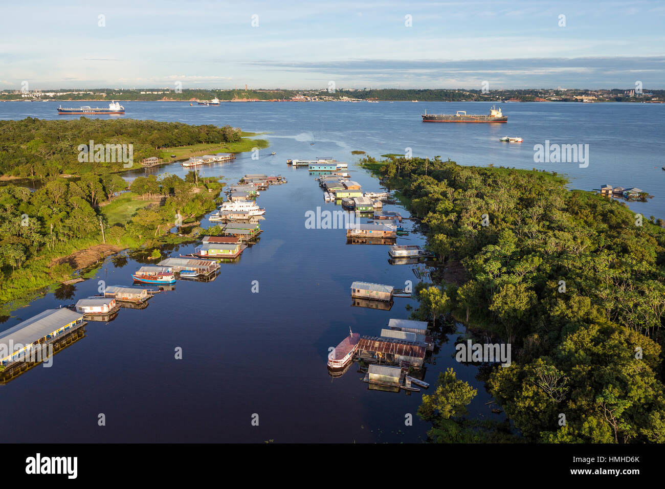 A floating community near Manaus in the Amazon, Brazil on the Rio Negro (Black River). The Rio Negro and the Amazon River are one and the same. Rainfa Stock Photo