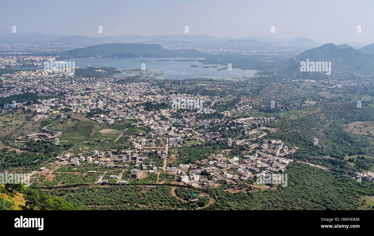 Aeriel view of Udaipur city and lake Pichola, mountains, constructions, greenery Stock Photo