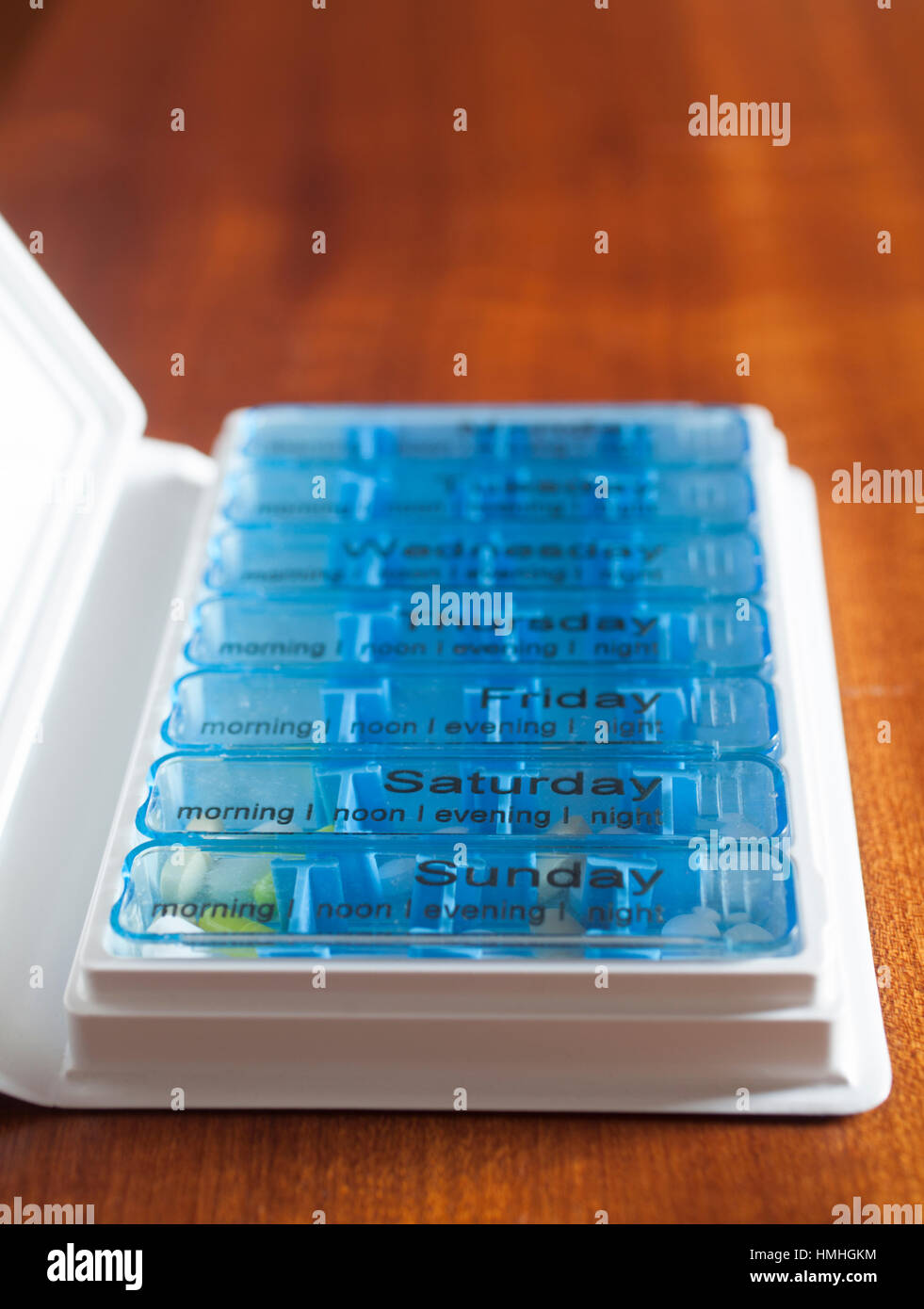 Stock photo of the inside of a Medi-Memo seven day pill organiser box with some tablets tken by a cancer patient in the Saturday and Sunday sections Stock Photo