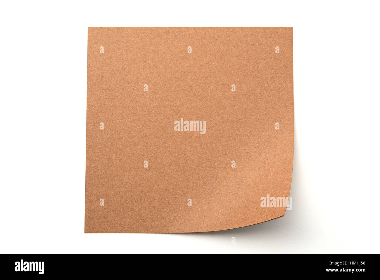 Brown paper stick note on a white background Stock Photo - Alamy