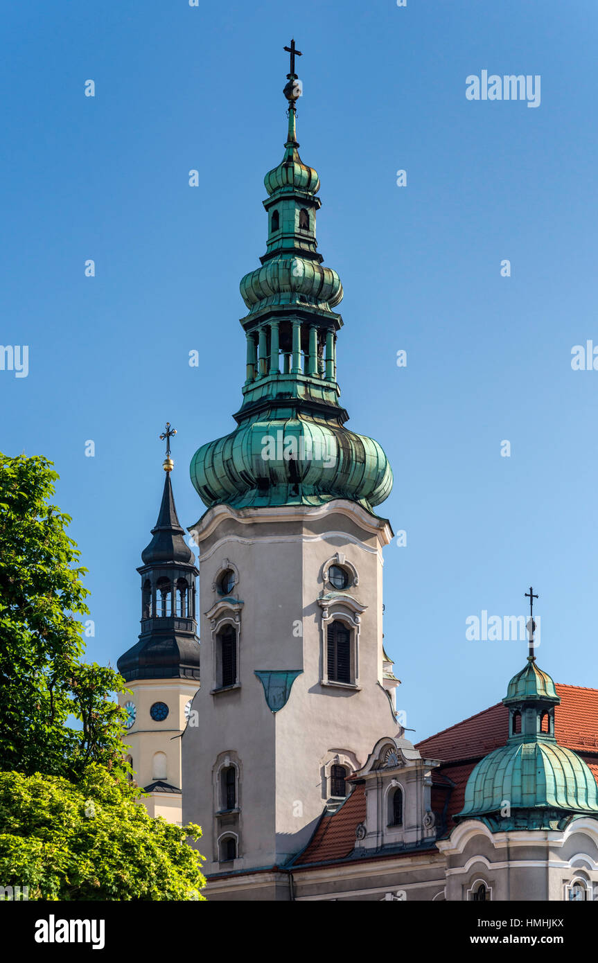 Towers of Evangelical Church and Catholic All Saints Church in Pszczyna, Silesia, Poland Stock Photo