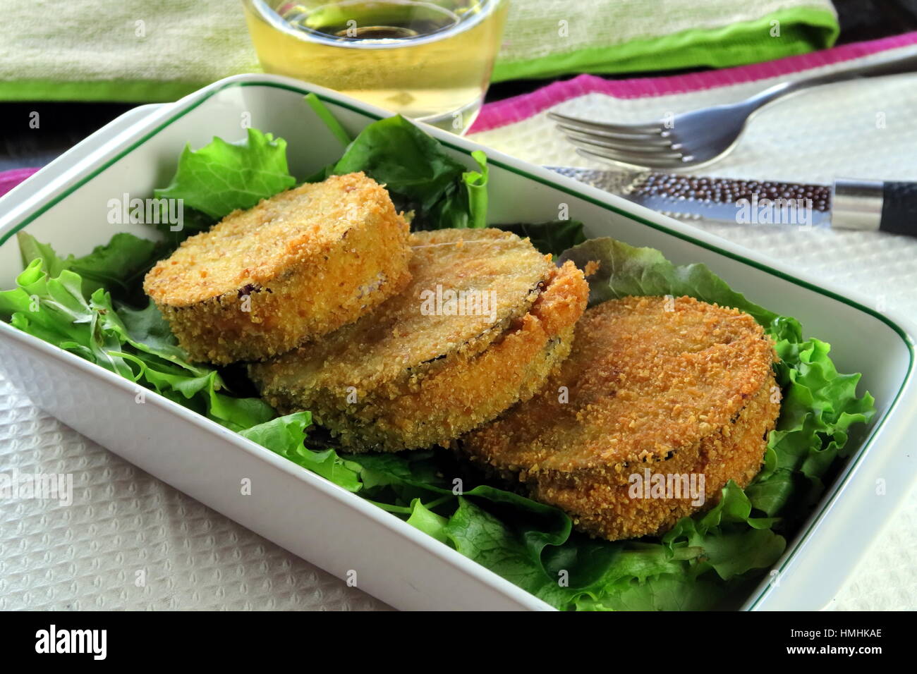 Aubergine and melted cheese vegetarian deep fried Cordon Bleu served in