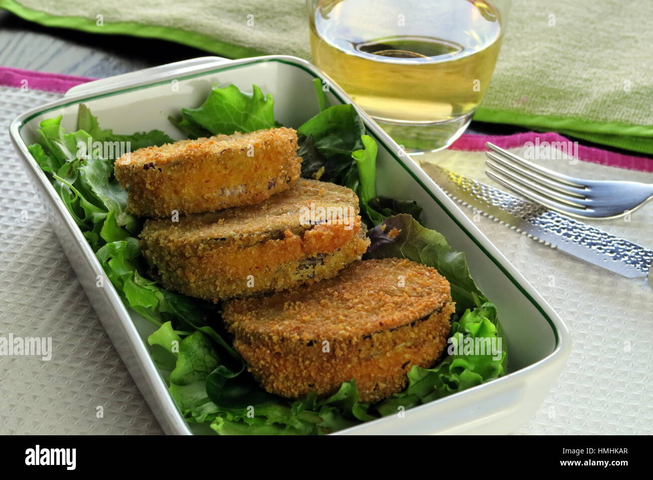 Aubergine and melted cheese vegetarian deep fried Cordon Bleu served in