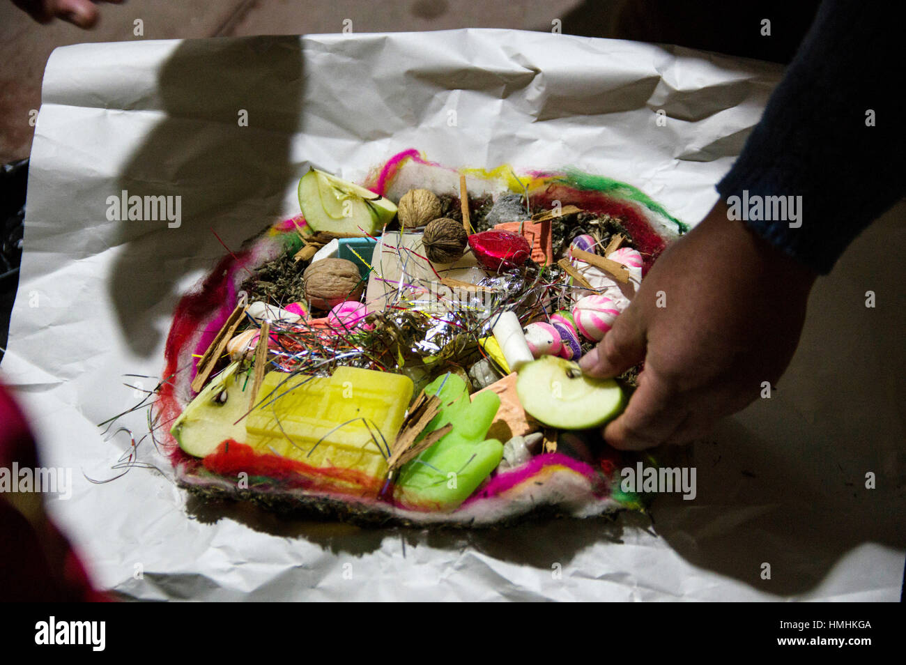 August in La Paz, Bolivia, witches or chifleras prepare an offering to ...