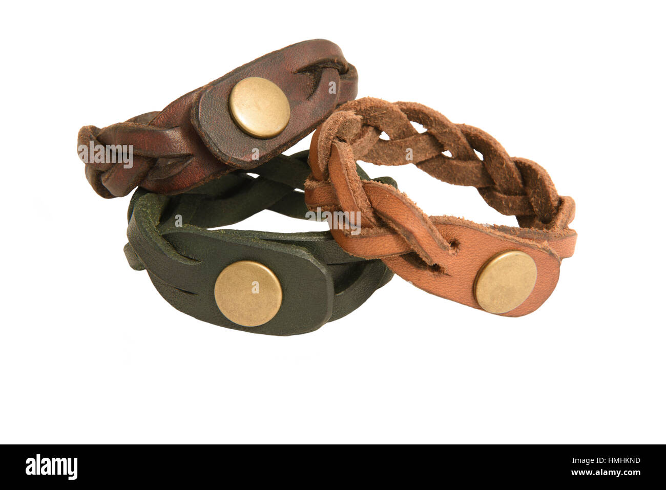Three handmade leather bracelets isolated against a white background