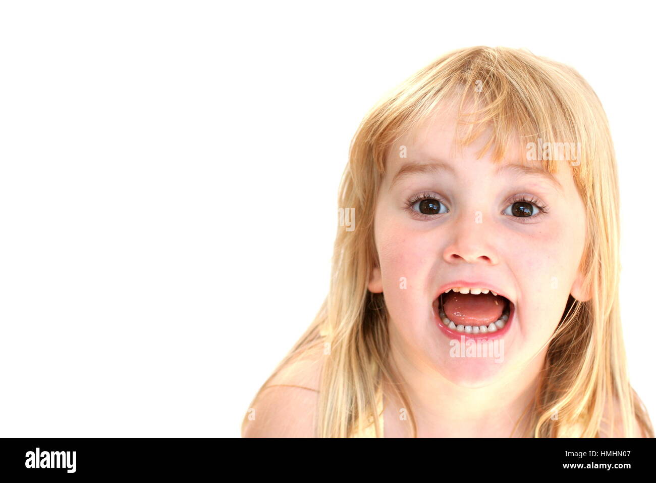 Blonde 4 year old child, with long hair, happy messing funny face concept laugh out loud, happy happiness joy best life laughing laugh mess goof Stock Photo