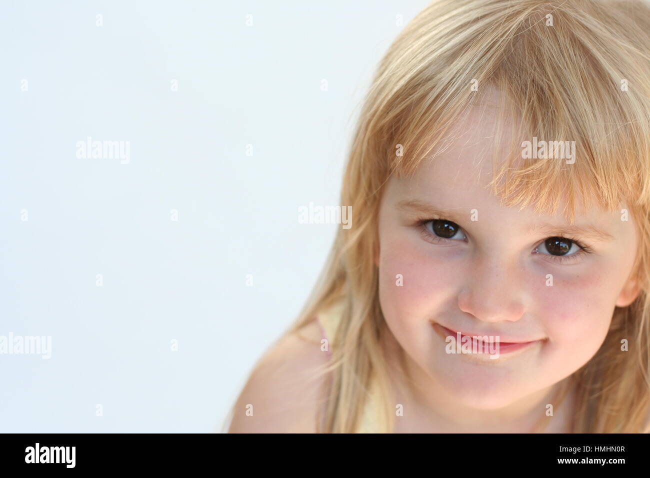 Sweet Blonde Little Girl With A Gentle Sweet Smile Portrait