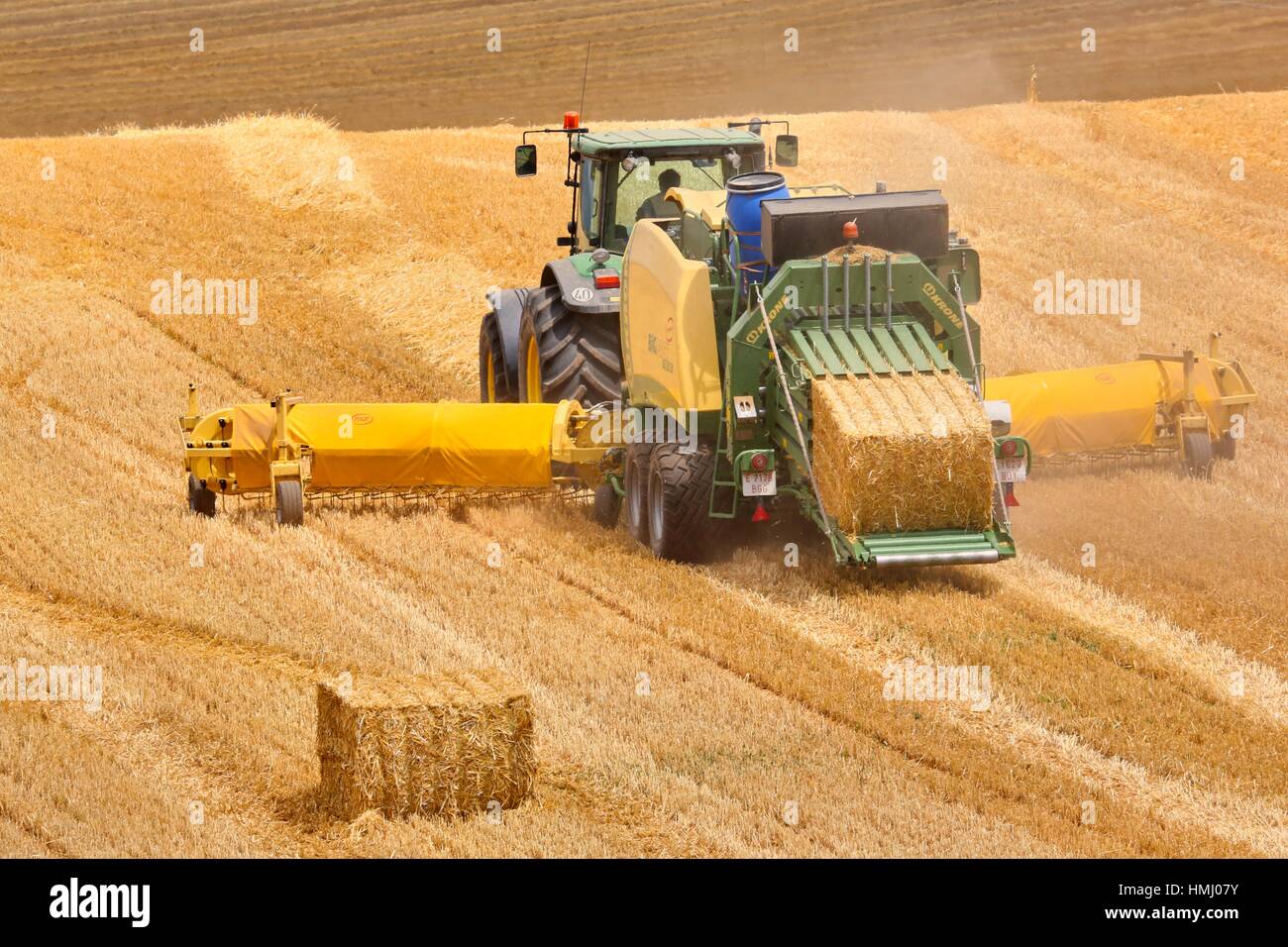 Straw baler. Agricultural machinery. Harvesting of cereals, «Learza« estate. Near Estella, Navarre, Spain Stock Photo