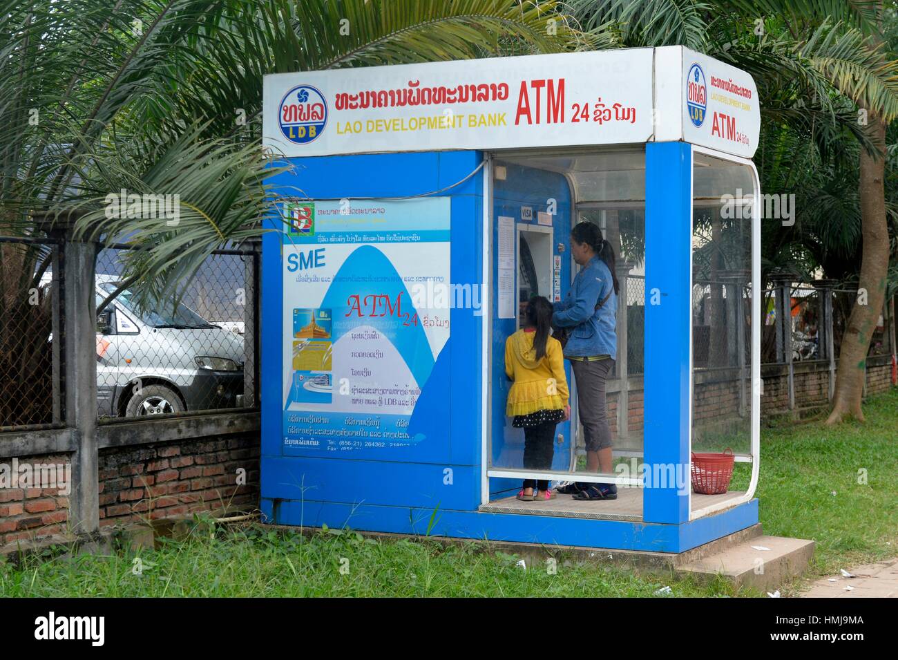 https www alamy com stock photo asian lady using an automated teller machine in laos south east asia 133168458 html