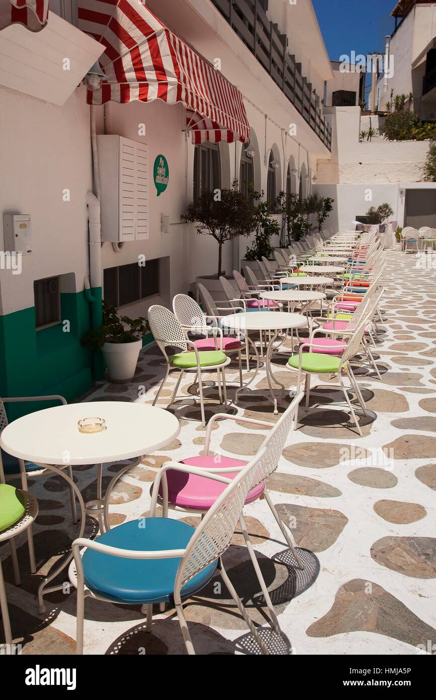 Open air cafe restaurant with colorful chairs in the old town