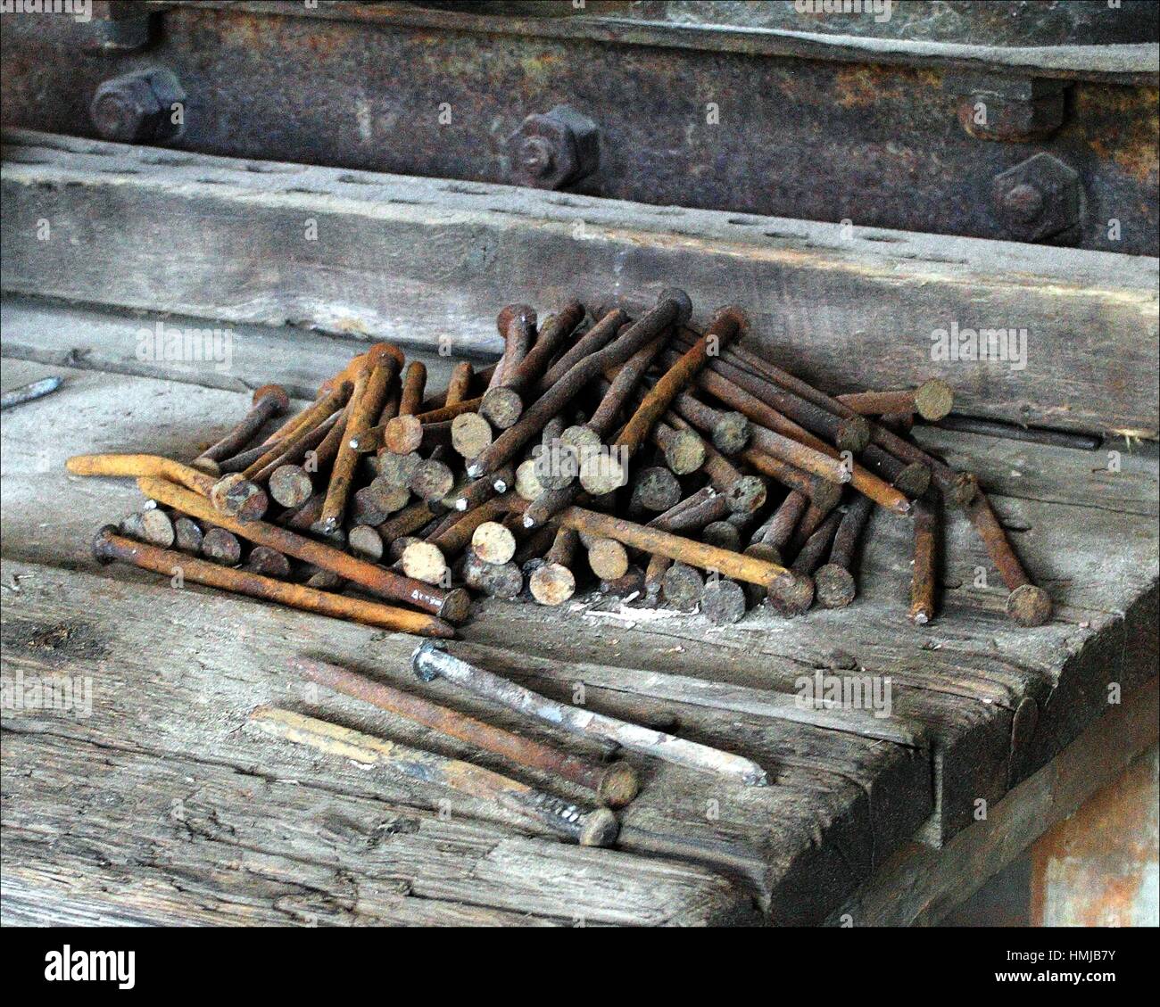 Rusty Old Nails Lie On A Bench Ready For Use In Another Time In An