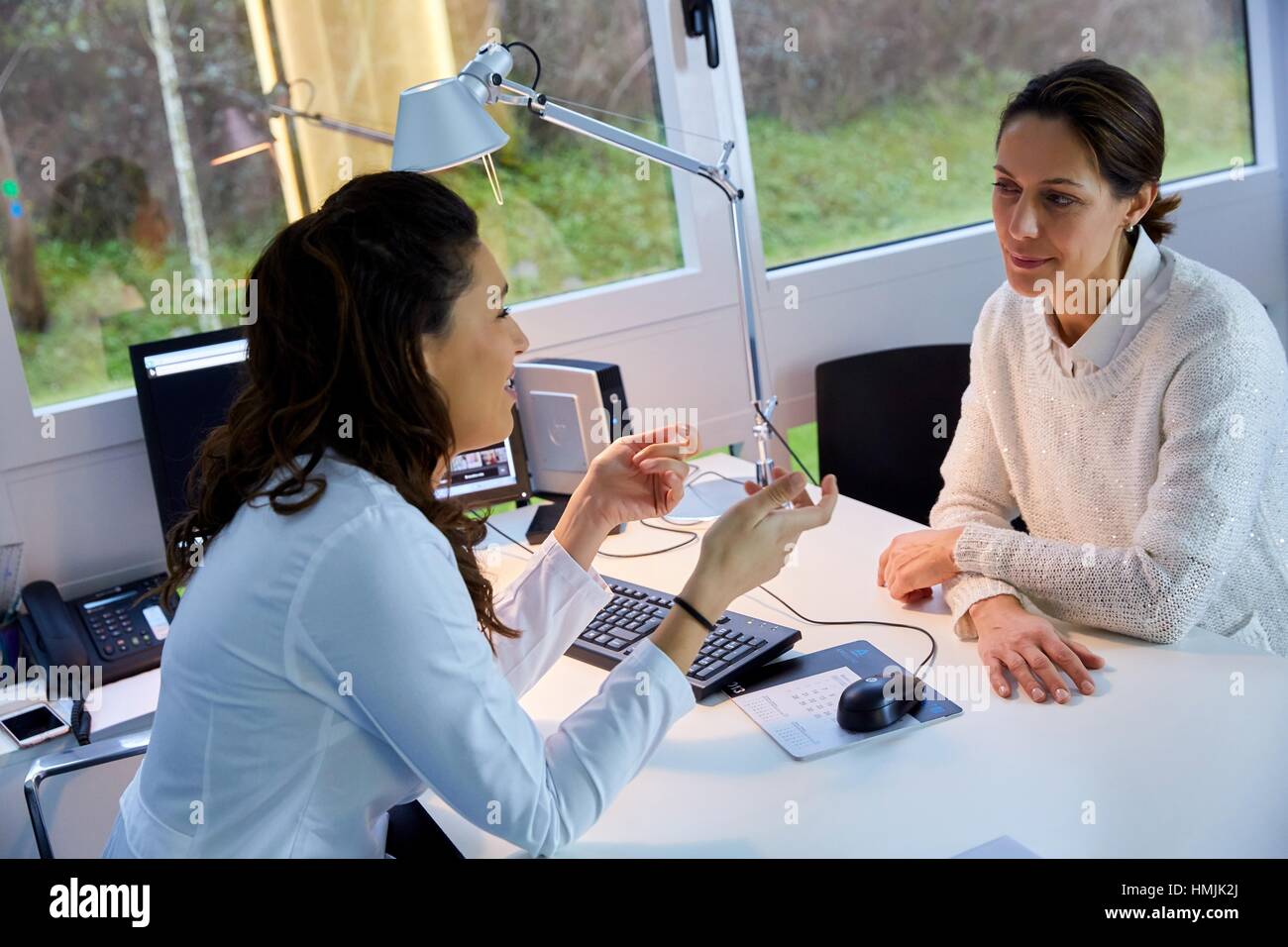 Doctor attending to patient medical consultation. Office. Plastic