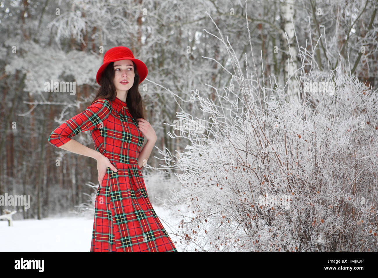 Girl in a red hat walks in Winter Park Stock Photo - Alamy