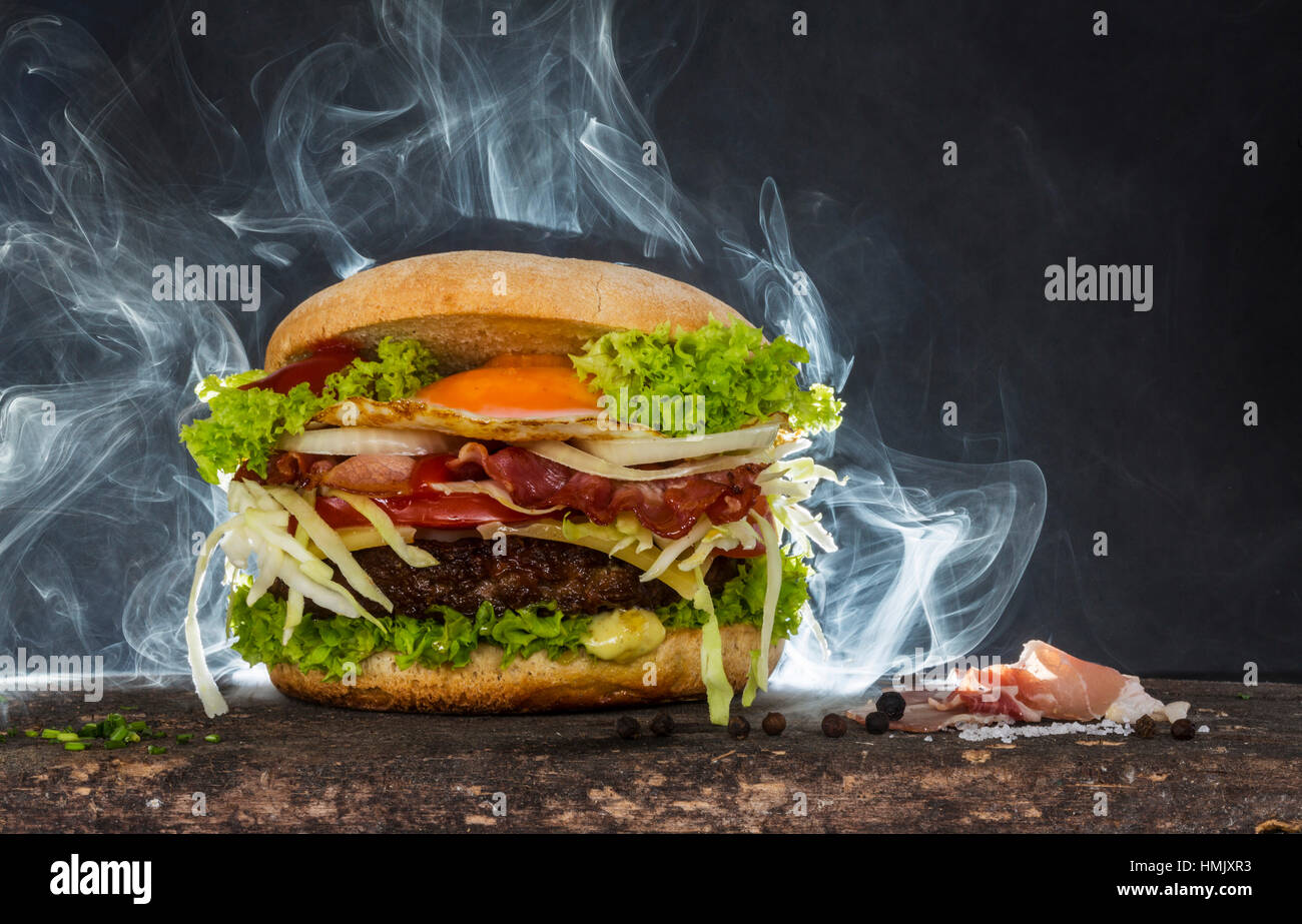 Steaming cheeseburger Stock Photo