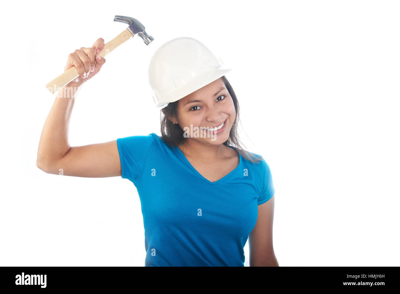 girl hitting her helmet with a hammer Stock Photo