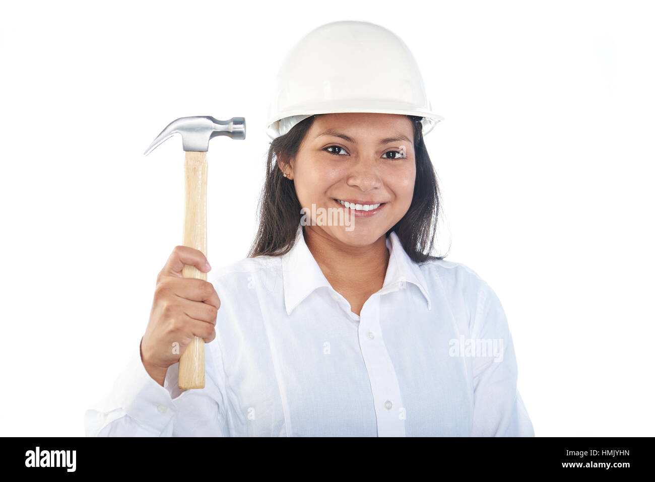 smiling latino girl with hammer and hard hat isolated on white Stock Photo