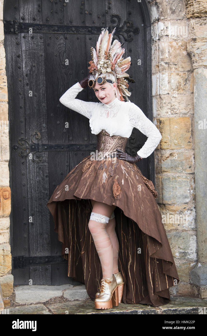 'Steam Punk' woman posing on cobbled street at Goth weekend in Whitby Yorkshire. Stock Photo