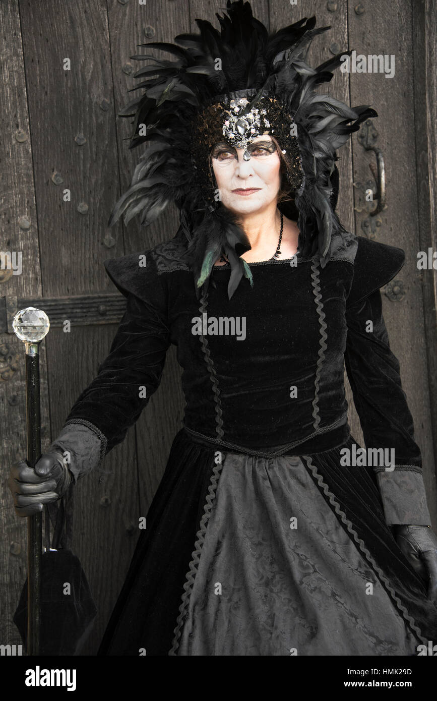 Goth woman posing in doorway at Goth weekend in Whitby Yorkshire. Stock Photo