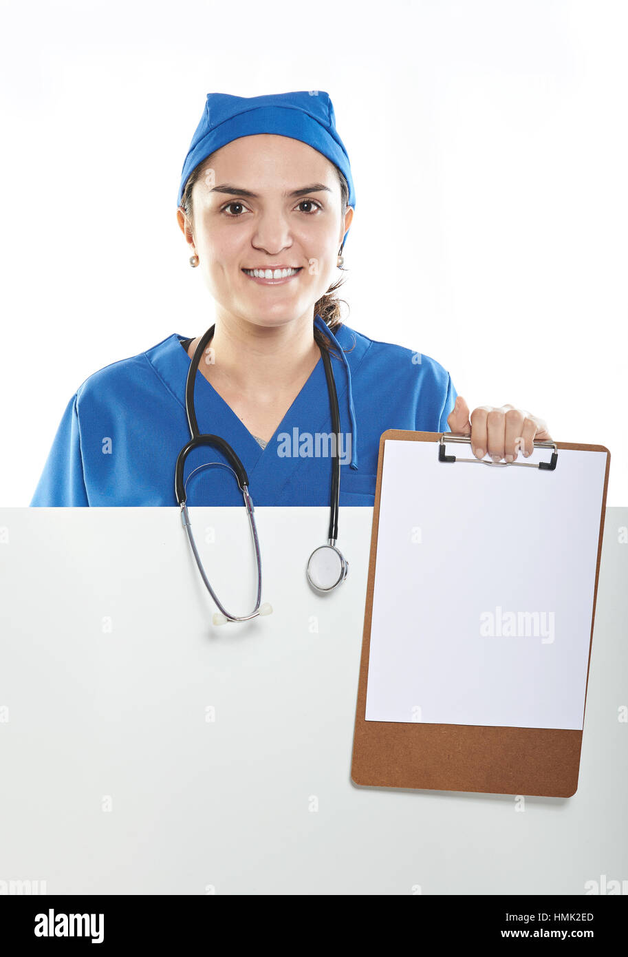 hispanic woman nurse with empty board isolated Stock Photo
