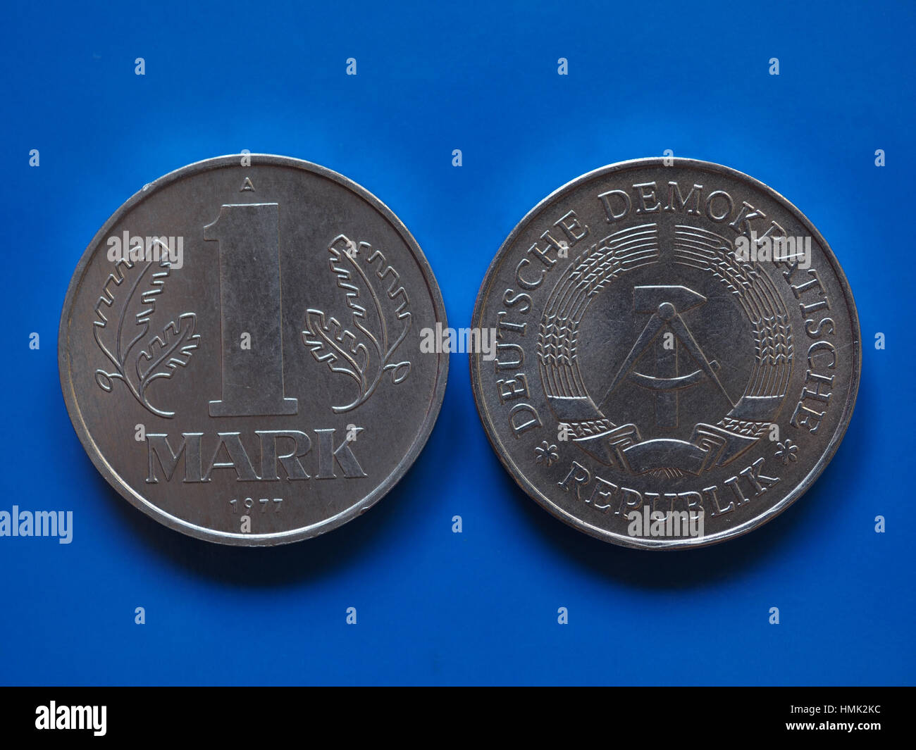 Vintage DDR (German Democratic Republic) 1 mark coin over blue background  Stock Photo - Alamy